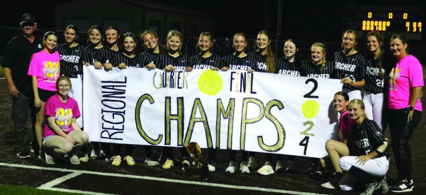 Lady Cats sporting the Regional Quarter Final winning banner on Friday, May 10 in Graham. The scoreboard in the background tells the story of the victory. Photo/Jerry Phillips