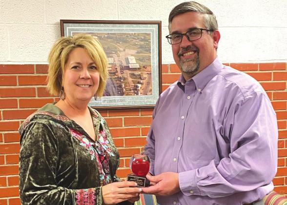 WISD Superintendent Dr. William Paul presents an award to business manager Juhree Vaughn for helping the district receive a superior financial rating each of the last 20 years. Courtesy photo