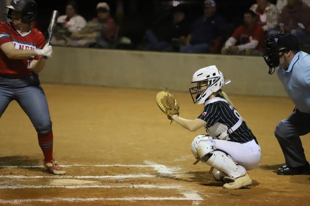 Addy Peters sits behind the plate