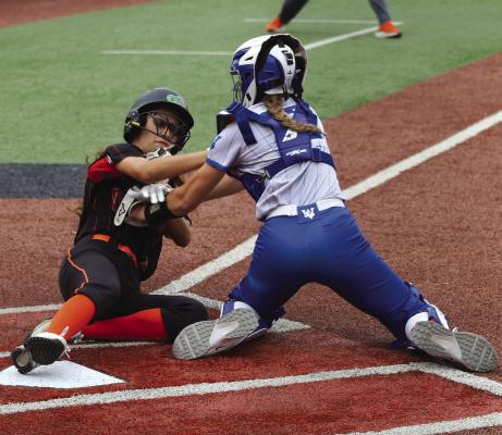 Windthorst senior Bri Hoff makes the tag at home plate during the Trojanette's matchup with Springtown. Photo/Landon Davis