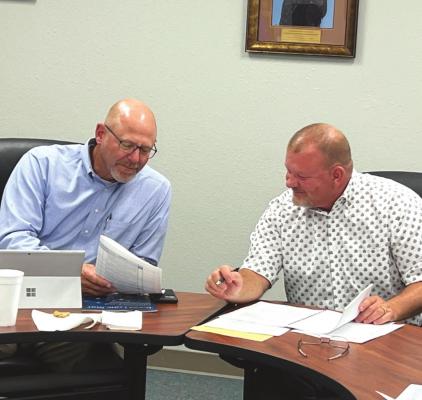 Holliday ISD School Board President Blake Jurecek reviews the preliminary budget with Superintendent Cody Carroll at the scheduled meeting on Monday, June 13. Photo/Will Edwards