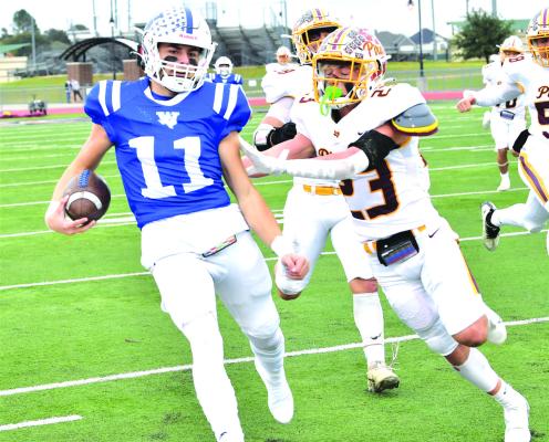 Late turnovers doom Trojans against Collinsville