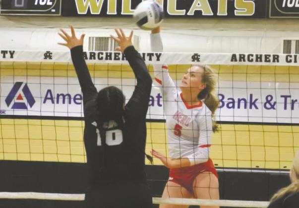Holliday’s Payton Murray attacks against Archer City’s Bailey Grant (10) on Monday, Sept. 1 Photo/Will Edwards