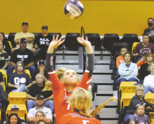 Holliday Sophmore setter Belle Welch passes the ball to the net in hopes of setting up a kill against Henrietta. Photo/Will Edwards
