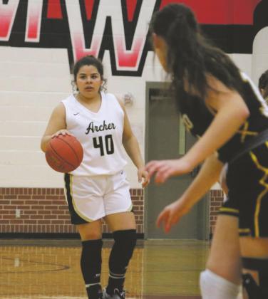 Archer City's Maddie Lopez scans the floor during the Lady Cats 72-36 bi-district loss to Cisco in Mineral Wells Friday, Feb. 12. Photo/Jerry Phillips
