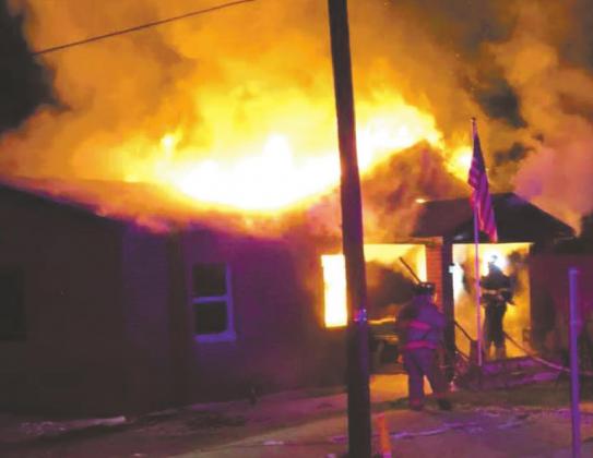 First responders battle Holliday structure fire