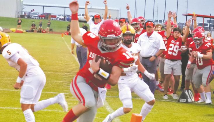 Holliday sophomore quarterback Peyton Marchand spins into the endzone in the first quarter of the Eagles’ 34-21 homecoming win over Bells on Friday, Sept. 18. Photo/Will Edwards