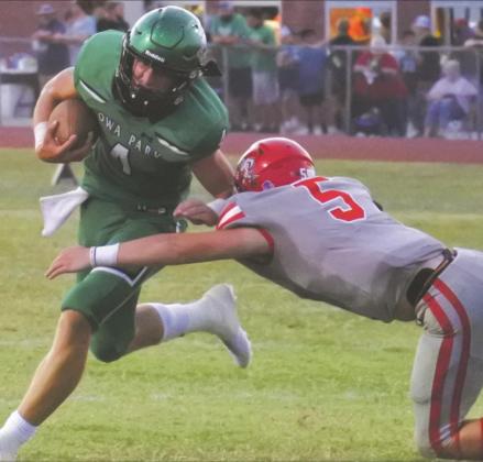 Holliday sophomore Jaxx Johnson wraps up Iowa Park’s Cirby Coheley in the second quarter of the Eagles’ 28-0 loss to the Hawks. Photo/Will Edwards