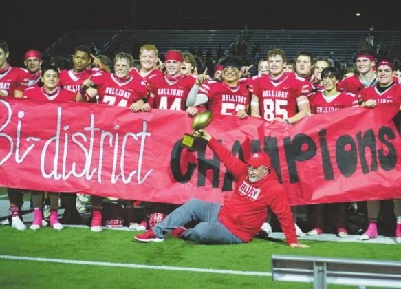 Holliday head coach Frank Johnson and the Eagles celebrate following a 21-13 bi-district win over Millsap on Friday, Nov. 13, in Graham. Photo/Callie Lawson