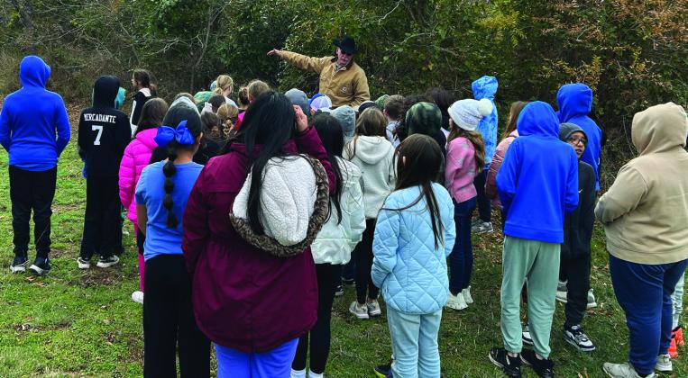 ACMAC Board Member Brad Mitchell discusses the history of the Comanche Tree Marker in Holliday to Windthorst ISD students on Tuesday, Dec. 10. Courtesy photo