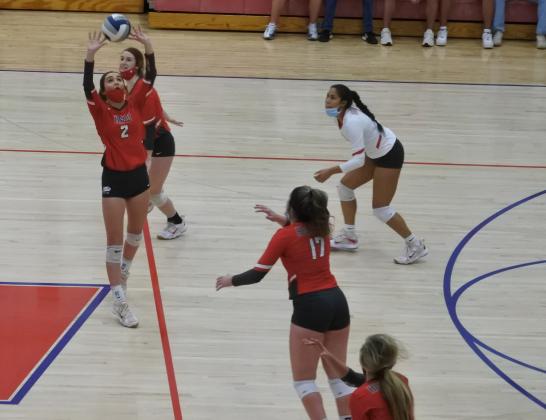 Sophomore Morgan Bodde sets up sophomore Addison Lindemann for a kill in the third set of Holliday’s 3-1 win over Wall in the Region I-3A area round on Tuesday, Nov. 3, in Tuscola.