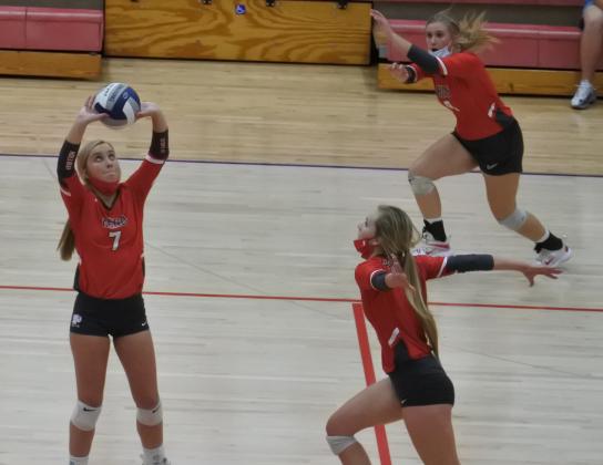 Sophomore Belle Welch sets the ball for junior Payton Murray in the third set of Holliday’s 3-1 win over Wall in the Region I-3A area round on Tuesday, Nov. 3, in Tuscola.