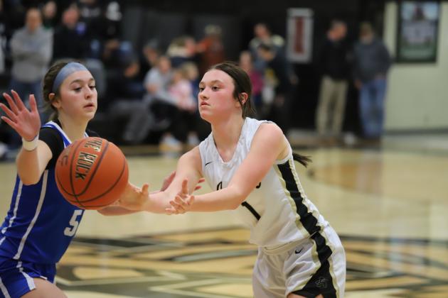 Archer City's Makaylee McCown passes the ball