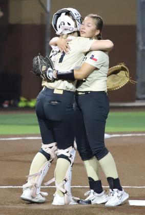 Peters and A. Canada hug
