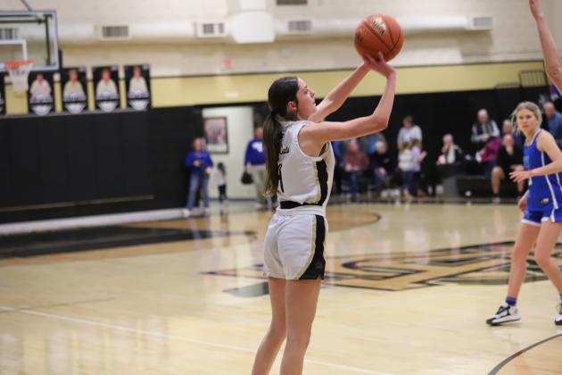 Archer City's Malia Jones attempts a three-pointer