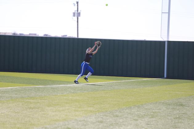 Malory Watson runs under a fly-ball