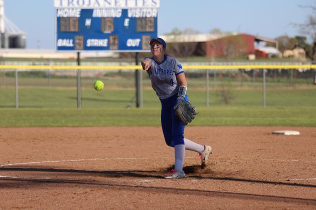 Kamdyn Neal pitches the ball