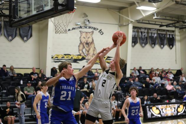Archer City's Layken Cagle puts in a tough block shot