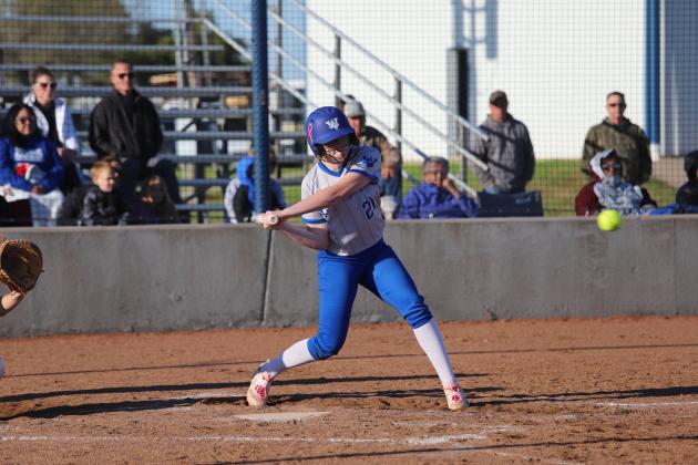 Charlee Wolf swings the bat 