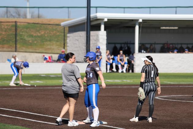 Coach Kirk talks with Heidi Tackett