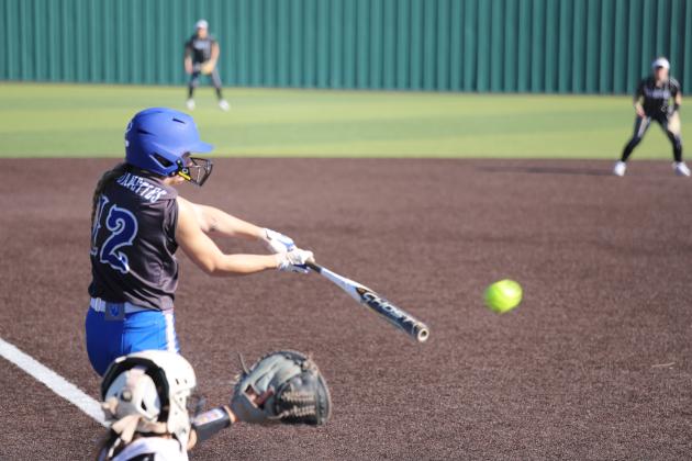 Bri Hoff makes contact with the ball