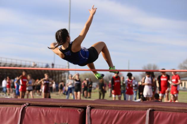 Saige Anderson jumps over the pole
