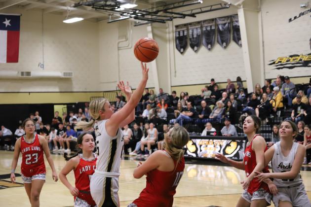 Archer City's Addy Peters attempts a shot over defender