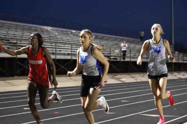 Isabel Bussey takes the baton from Rylee Wolf