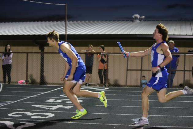 Brock Belcher hands off to Jaxon Stark