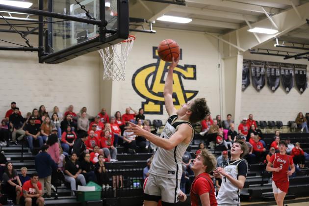 Archer City's Landon Smith attempts a high-altitude layup