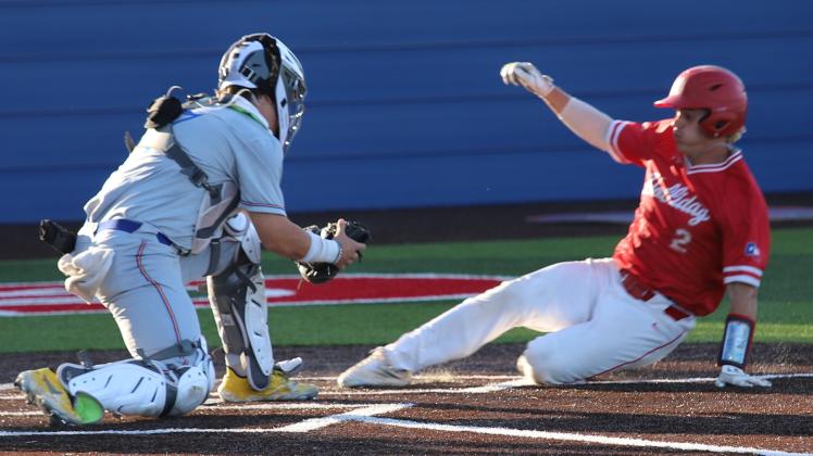 Parker Jones slide into home