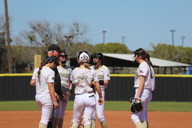 Coach Kyle meets with the infield