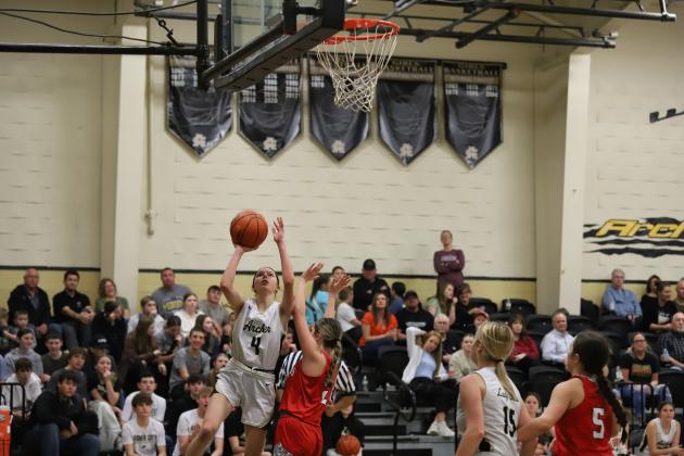 Archer City's Malia Jones attempts a layup over defender