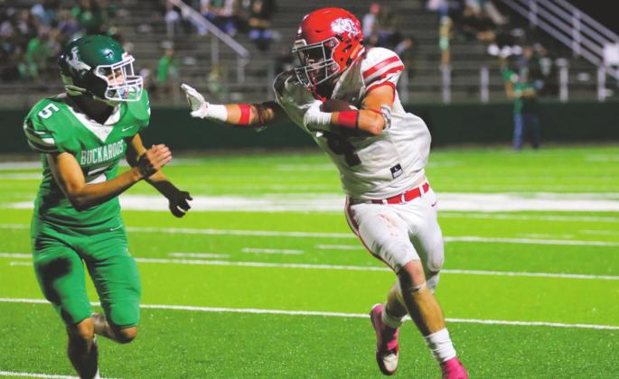 Holliday senior Crae Jackson stiff-arms a defender in the Eagles’ 35-12 win over Breckenridge on Friday, Sept. 25. Courtesy Photo/Jolene Styles\.