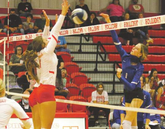 Seniors Brittany James and Bree Zellers go up for a block on their Senior Night win over Childress on Tuesday, Sept. 29. Courtesy photo/Jolene Styles