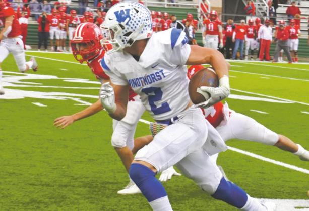 Kyle Wolf breaks free for a 68 yard gain to setup the game-winning score in the Trojans’ regional semifinal win over Albany on Nov. 27. Photo/Will Edwards