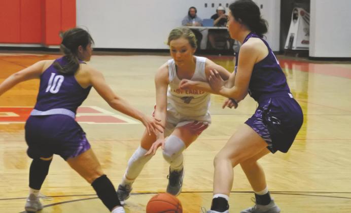Holliday’s Payton Murray splits the Tigerettes double team in the third quarter of the Lady Eagles’ 72-37 win over Jacksboro on Tuesday, Jan. 26. Photo/Will Edwards
