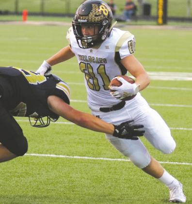Gage Gillipsie (81) runs with the ball against Henrietta Friday, Sept. 18. Gillipsie finished with four interceptions and a fumble recovery on the defensive side of the ball. Photo/Jenny Schroeder