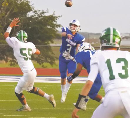 Senior Cy Belcher throws a pass in the first quarter of the Trojans’ 14-0 loss to Hamlin on Friday, Oct. 2. Photo/Will Edwards