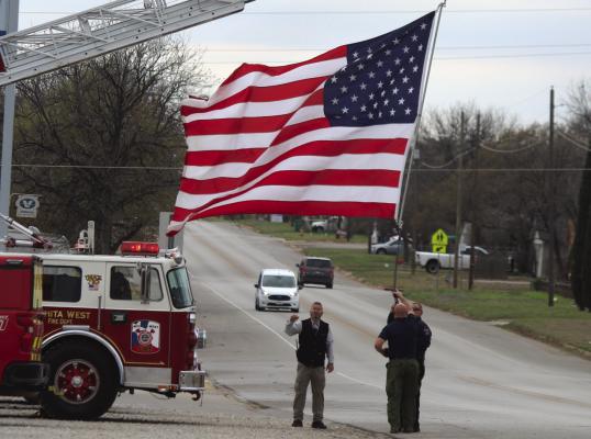 One of the many flags displayed by regional fire departments on Center Street Friday, March 15, honoring Jack Roberts who died March 11. Photo/Jerry Phillips