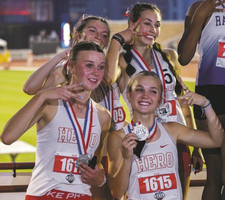 The Lady Eagle 4x400 show off their silvers following a school recording breaking time of 3:47.8. Courtesy photo/Jim Harrison