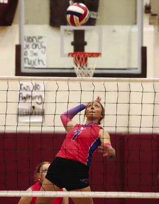 Senior Isabel Bussey rises high for a kill in the Trojanettes’ 3-0 sweep over the Memphis Lady Cyclones in the Bi-District playoff round on Monday, Nov. 4. Photo/Landon Davis