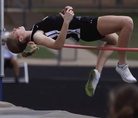 Archer City freshman Lyla Nichols glides over the high jump bar at the Windthorst High School Invitational on Wednesday, April 1. Photo/Landon Davis
