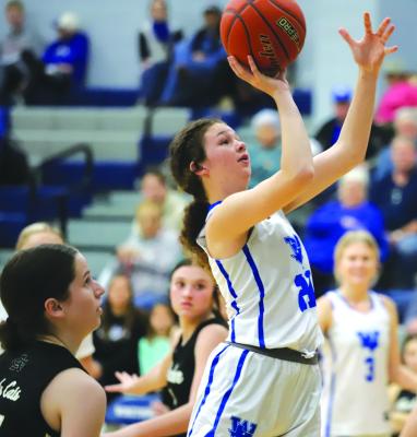 Windthorst's Abby Schroeder puts up a floater in the Trojanettes' 71-33 win over Archer City on Friday, Jan. 5. Photo/Landon Davis