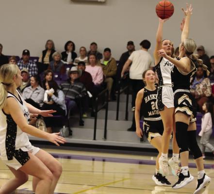 Archer City junior Serenity Jones sends up a jump shot over a Haskell defender in the Lady Cats’ Bi-District game against the Maidens on Monday, Feb. 10. Photo/Jerry Phillips