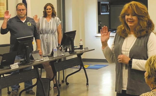 William Rutledge (left), Kim Williams (middle), Pamela Morgan Davis (right) are sworn into terms on the Lakeside City city council on Tuesday, May 18. Photo/Nathan Lawson