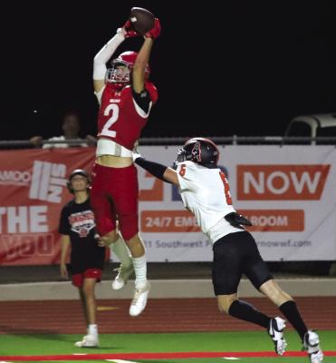 Senior wideout Ashtyn Berry makes the flying grab against the Burkburnett Bulldogs on Friday, Sept. 20. Berry torched the Bulldogs for eight receptions for 196 yards and two touchdowns Friday night. Photo Landon Davis