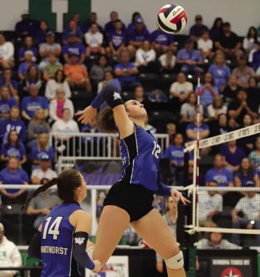 Trojanette middle Kyah Frank loads up for a kill against Crawford in the State Semifinals on Saturday, Nov. 15 Photo/Landon Davis