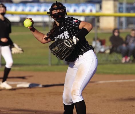 Archer City Freshman pitcher Addi Canada tries to pick off a runner at first base in the Lady Cats win over Windthorst Tuesday, March 26. Photo/Landon Davis