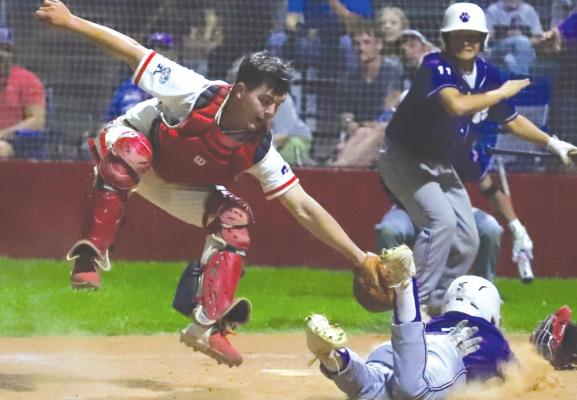 Holliday's Peyton Marchand gets the tag down a hair too late in the Eagles' 12-6 win over Jacksboro on Tuesday, April 5. Photo/Will Edwards
